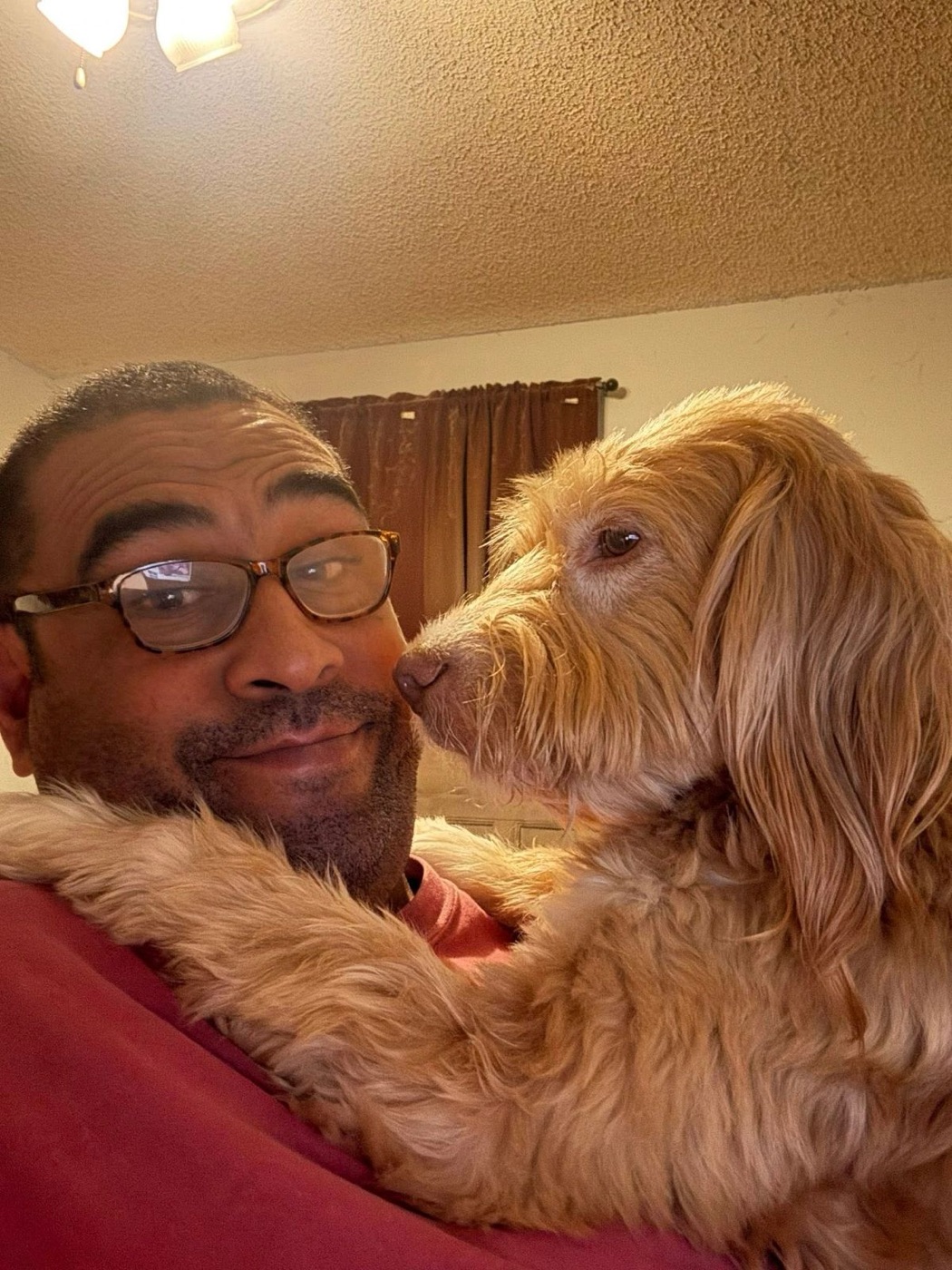 Frank with a happy golden retriever